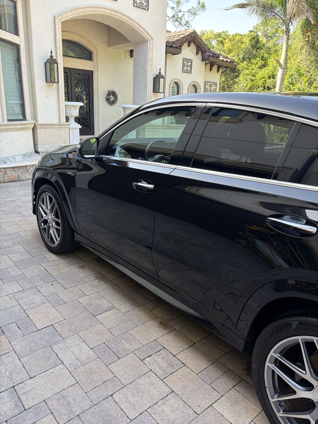 Black Mercedes-AMG GLE side profile with mirror finish