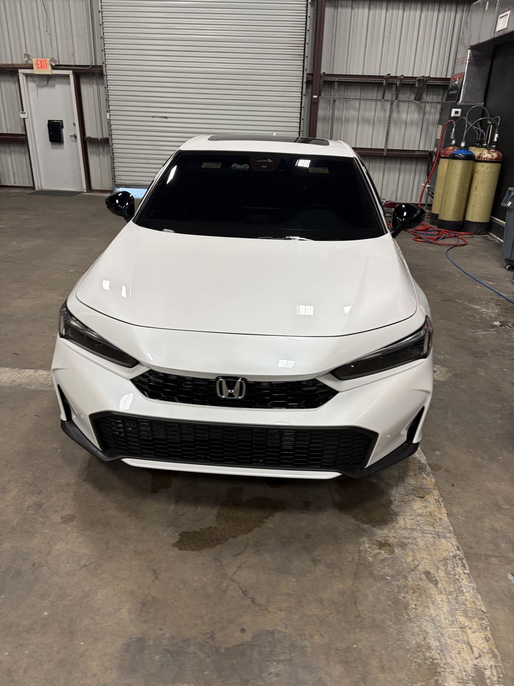 White Honda Civic with glossy paint after ceramic coating at the APES shop