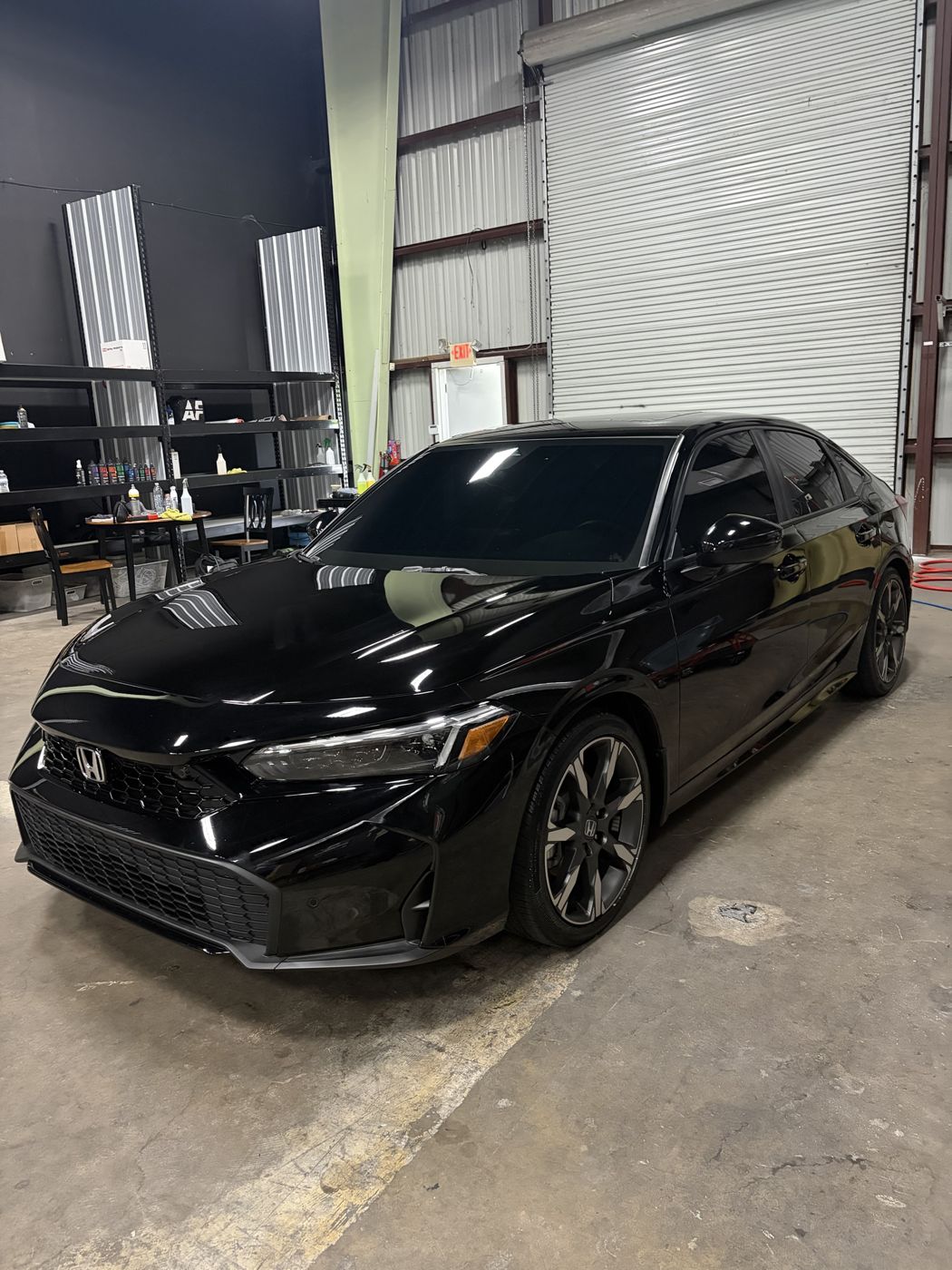 Black Honda Civic Sport Touring with a fresh ceramic coating at the APES shop