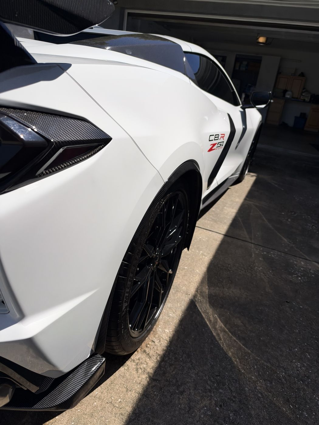 White Corvette C8 Z51 with carbon fiber trim after paint correction and coating
