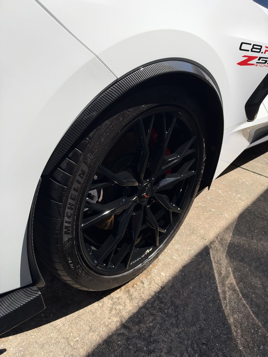 Corvette C8 forged black wheel and Michelin tire after cleaning and dressing