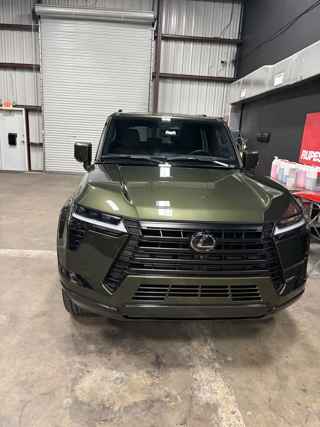 Green Lexus GX front end showing gloss after ceramic coating