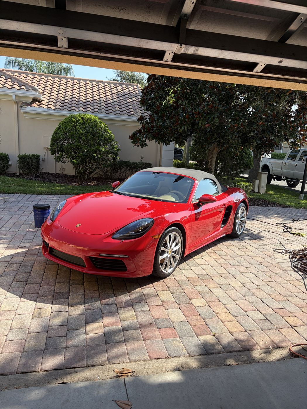 Red Porsche 718 Boxster after a mobile detail in Orlando