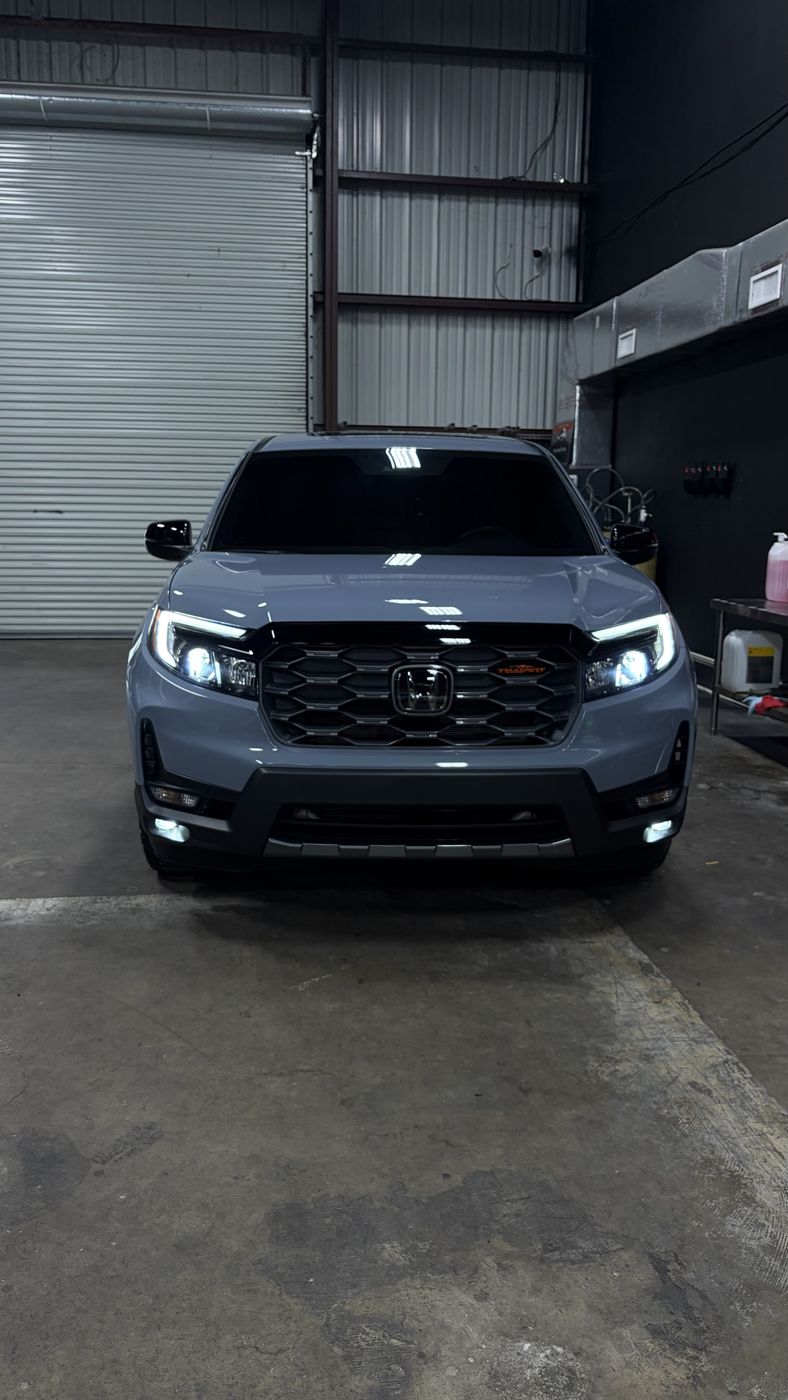Honda Ridgeline TrailSport front view with lights on after ceramic coating
