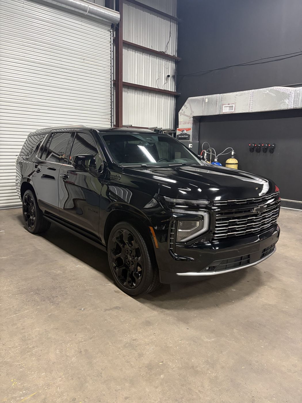 Black Chevy Tahoe showing deep gloss after ceramic coating