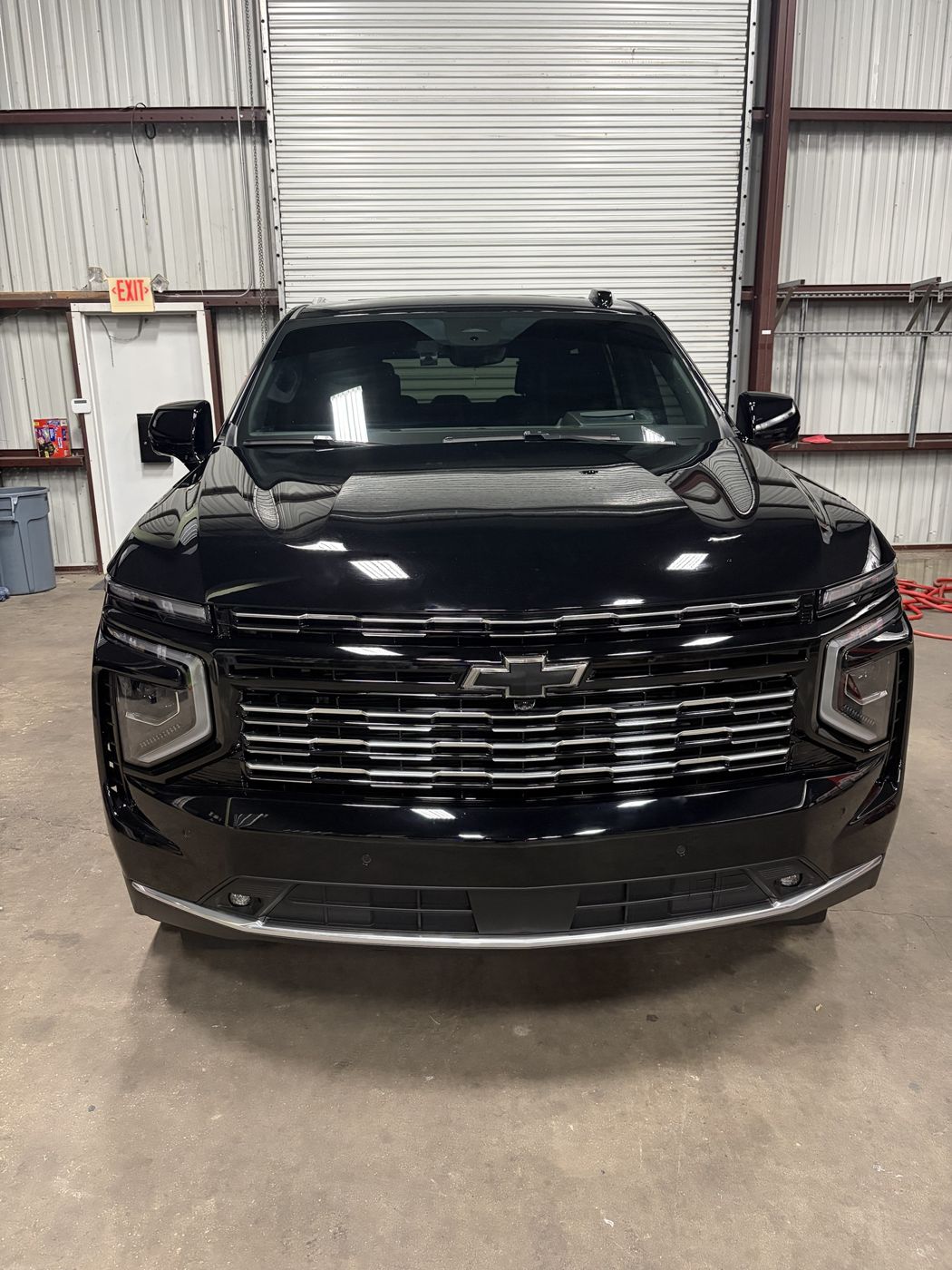 Black Chevy Tahoe High Country with a fresh ceramic coating at the APES shop in Orlando